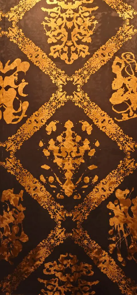 A beautiful pattern on the wall in golden color