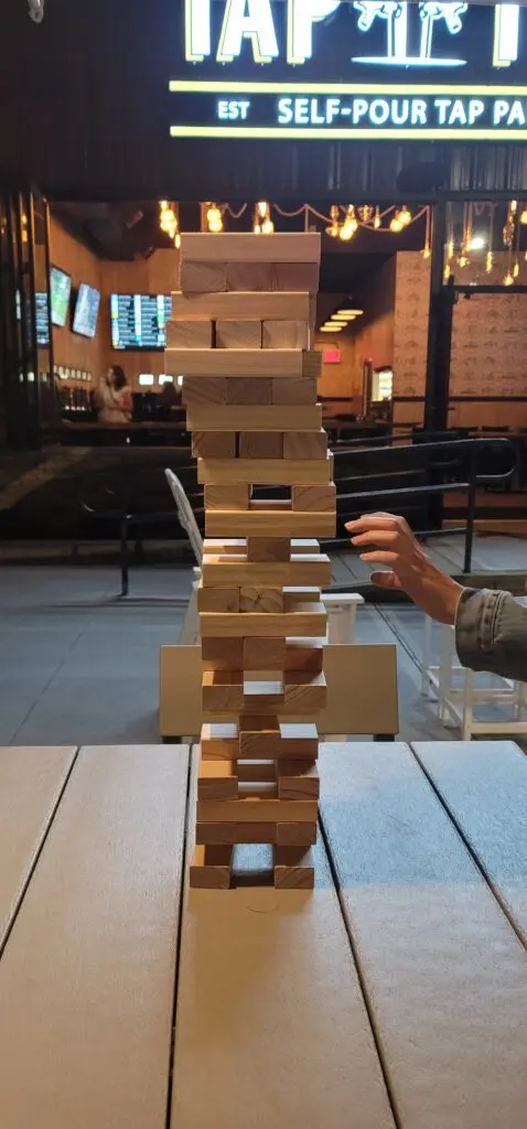 People playing Jenga at the Tap That Bar