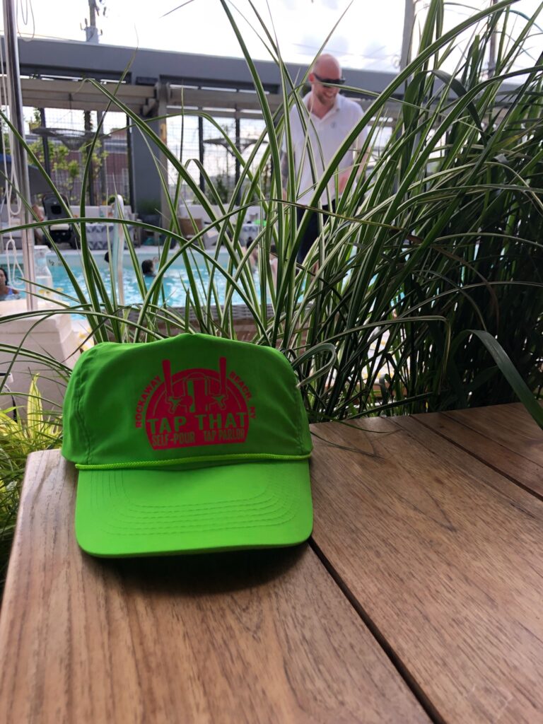 A picture of a green cap that says Tap That